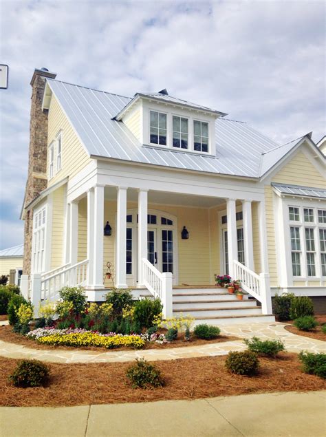 yellow houses with metal roofs|yellow house with gray roof.